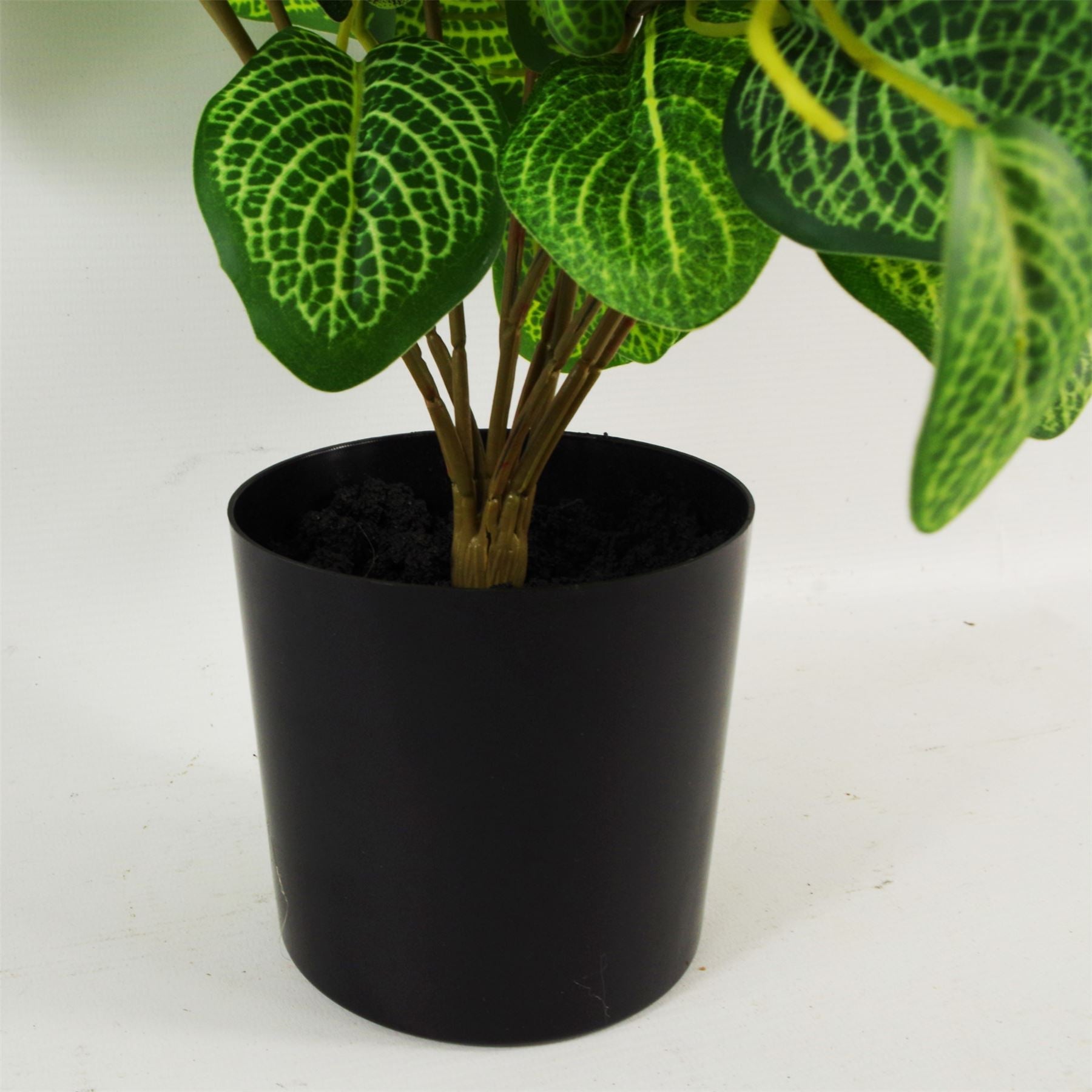 Large artificial variegated pothos plant with realistic green leaves in a weighted black plastic pot — view 5