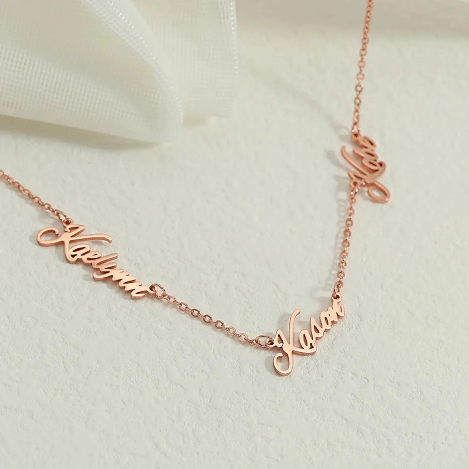 Personalized multiple name necklace in gold featuring custom elegant script fonts on an adjustable chain — view 4