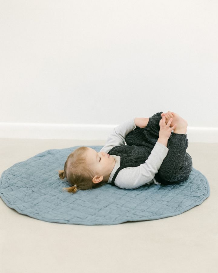 Stone washed linen quilted play mat in a neutral hue with thick, soft cotton filling