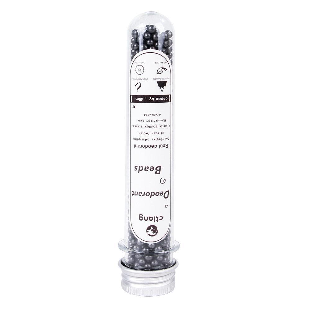 Activated carbon cat litter deodorizer beads in a small bottle for odor control. — view 5