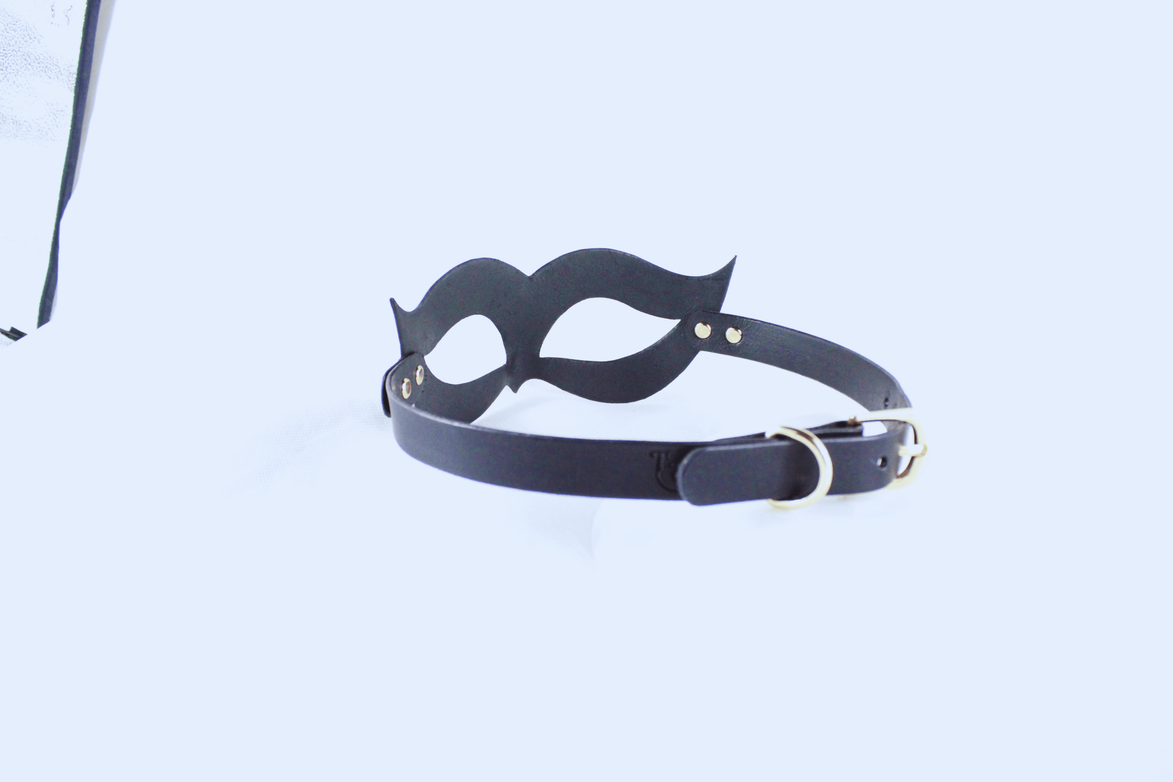 Handmade black leather fetish mask with gold-tone rivets and adjustable buckle strap for a secure fit. — view 4