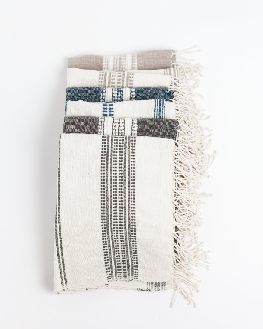 Aden cotton hand towel in a folded stack, showcasing rich hand-spun Ethiopian cotton texture — view 4