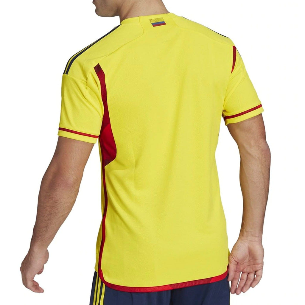 Official yellow and navy Colombia national team home soccer jersey for 2022/23 by Adidas — view 3
