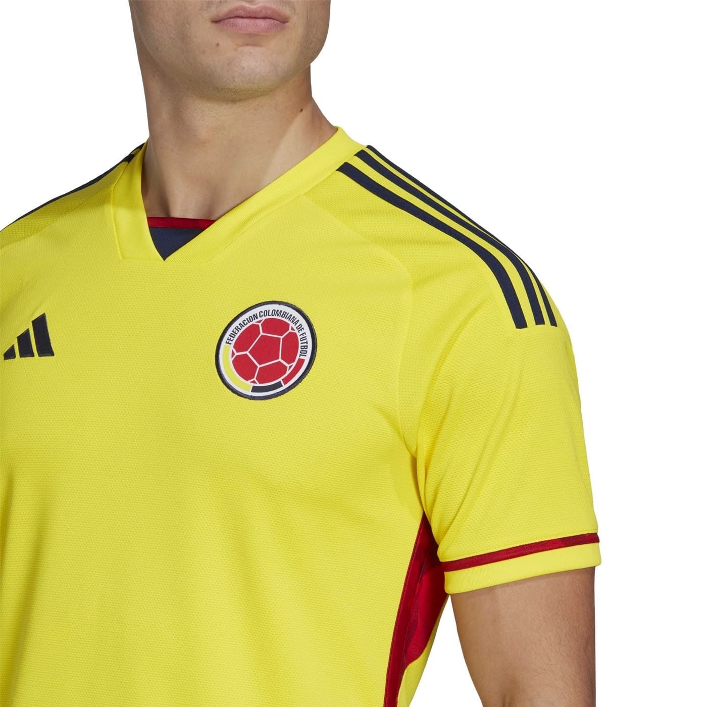 Official yellow and navy Colombia national team home soccer jersey for 2022/23 by Adidas — view 4