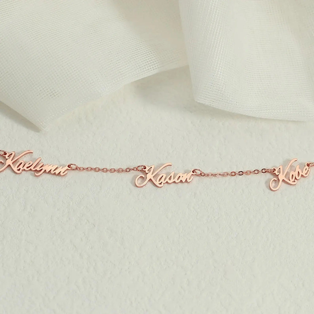 Personalized multiple name necklace in gold featuring custom elegant script fonts on an adjustable chain — view 5