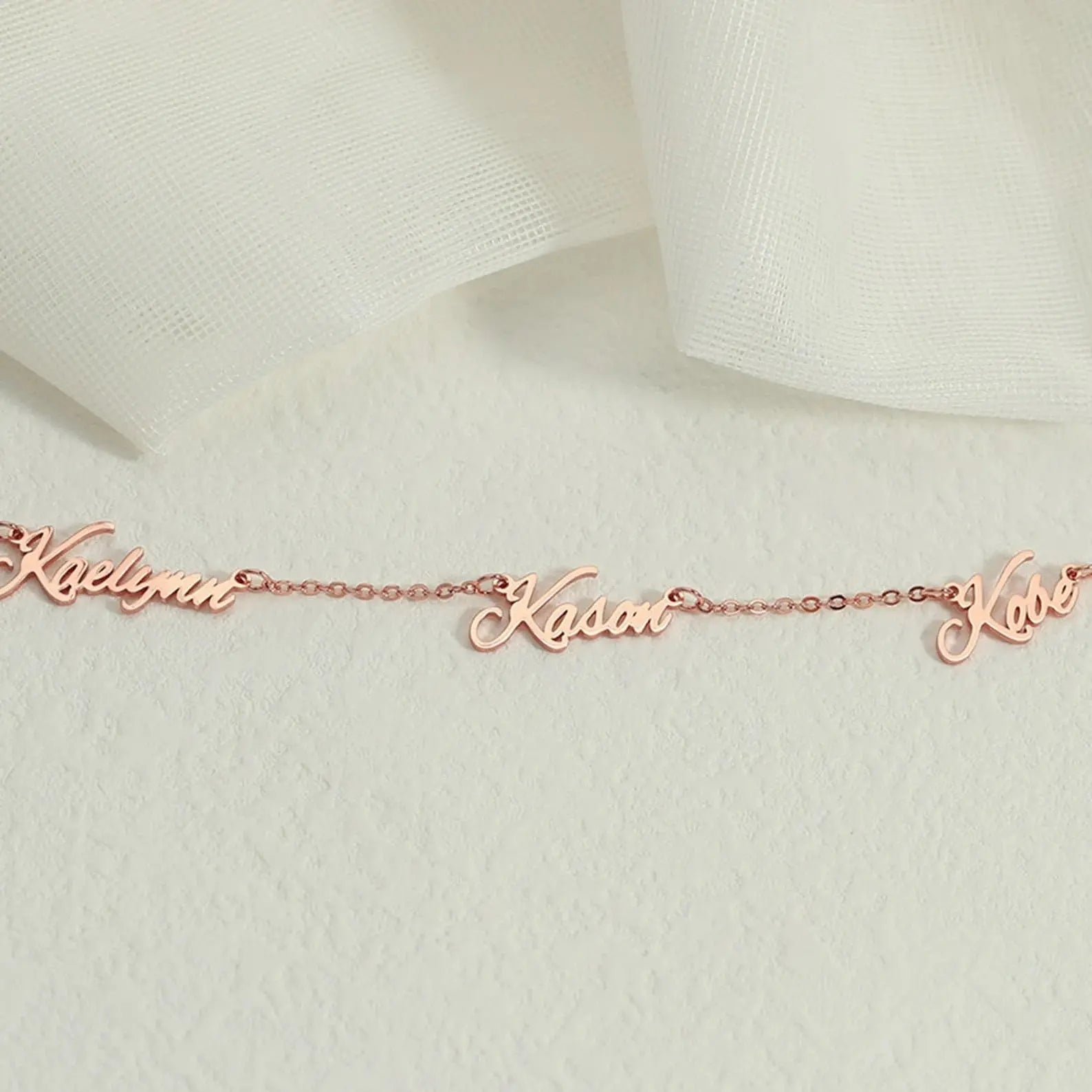 Personalized multiple name necklace in gold featuring custom elegant script fonts on an adjustable chain — view 5