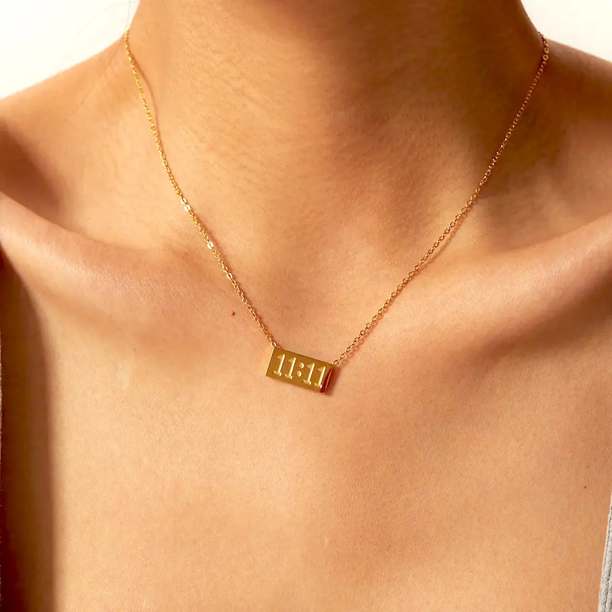 1111 angel number necklace featuring a polished minimalist pendant and an adjustable hypoallergenic chain — view 2