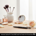 Charcoal automatic eyebrow pencil with angled tip and spoolie brush on a clean background