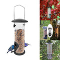 Black metal and transparent plastic automatic hanging bird feeder for outdoor garden spaces.