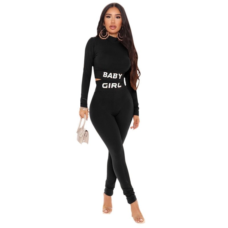 Women's letter print gym tracksuit featuring a long sleeve crop top and flexible matching leggings.
