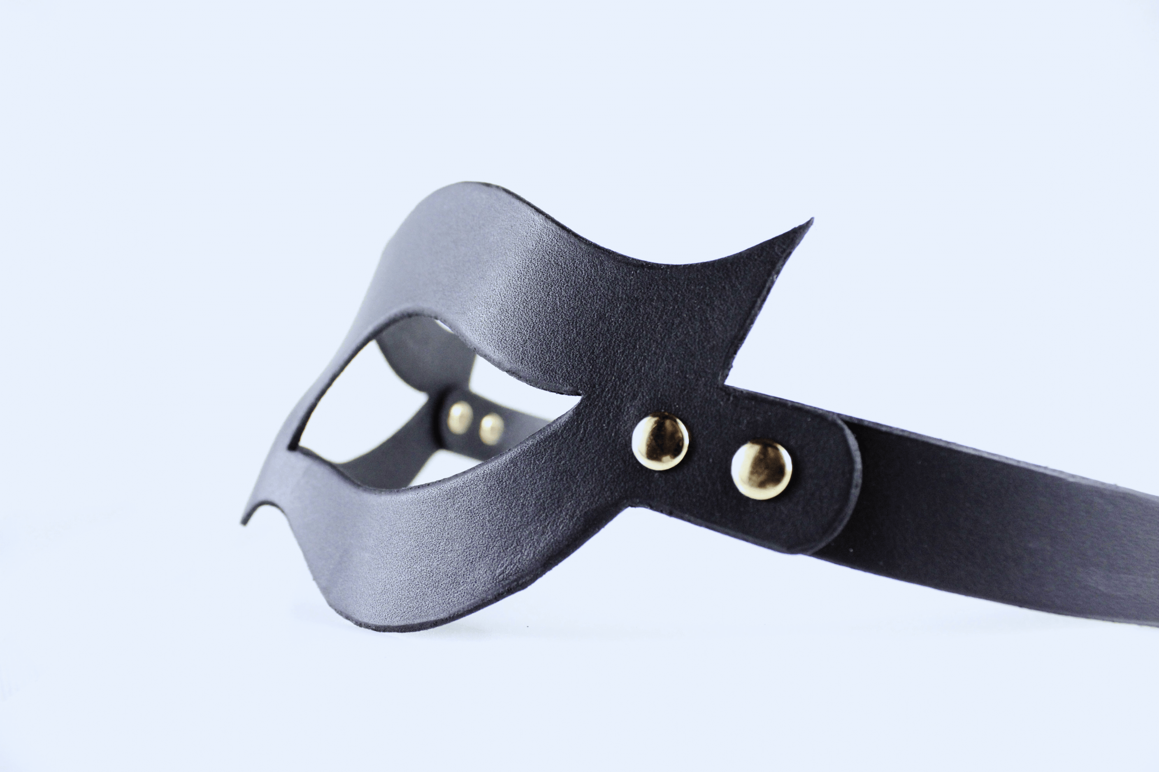 Handmade black leather fetish mask with gold-tone rivets and adjustable buckle strap for a secure fit. — view 5