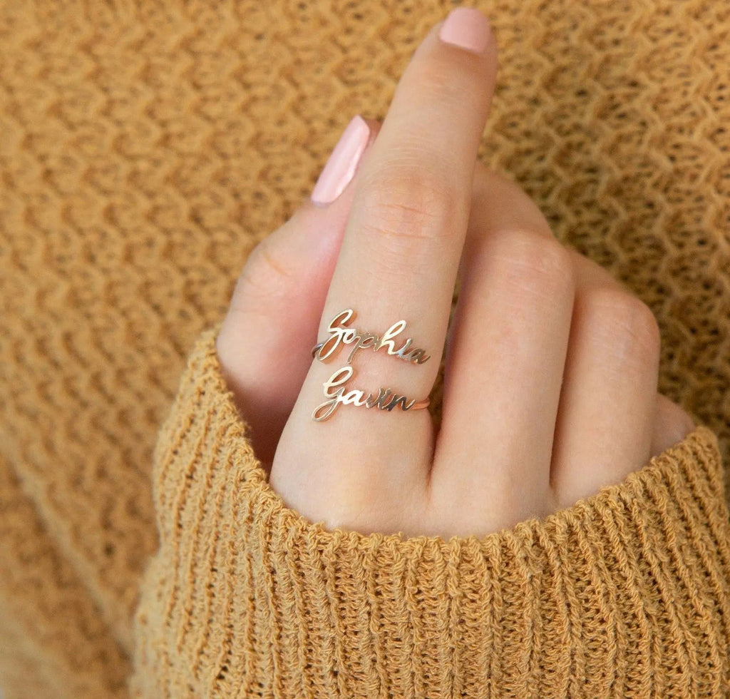 Personalized custom name ring in polished 18k gold featuring delicate cursive typography styling