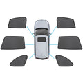 Magnetic car window sun shade in black nylon mesh fitted on a Subaru Outback