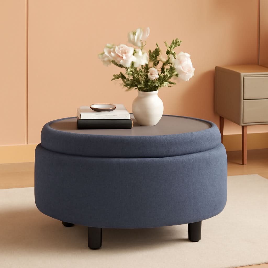 Blue upholstered circular storage ottoman with reversible wooden serving tray and hidden storage compartment