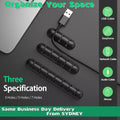Silicone desk cable organizer clips holding various USB and charging cords on a flat surface