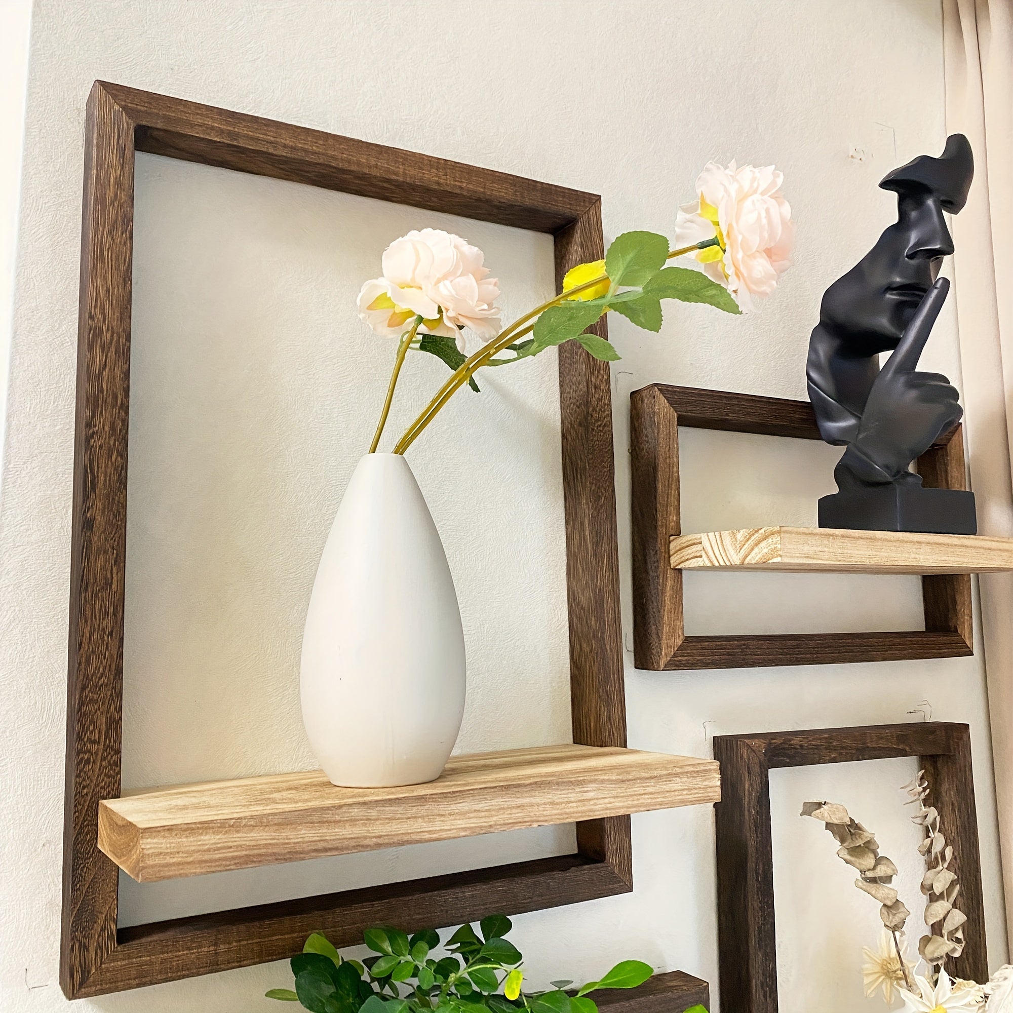 Four piece brown wooden floating wall shelf set displaying small decor items and plant pots — view 4