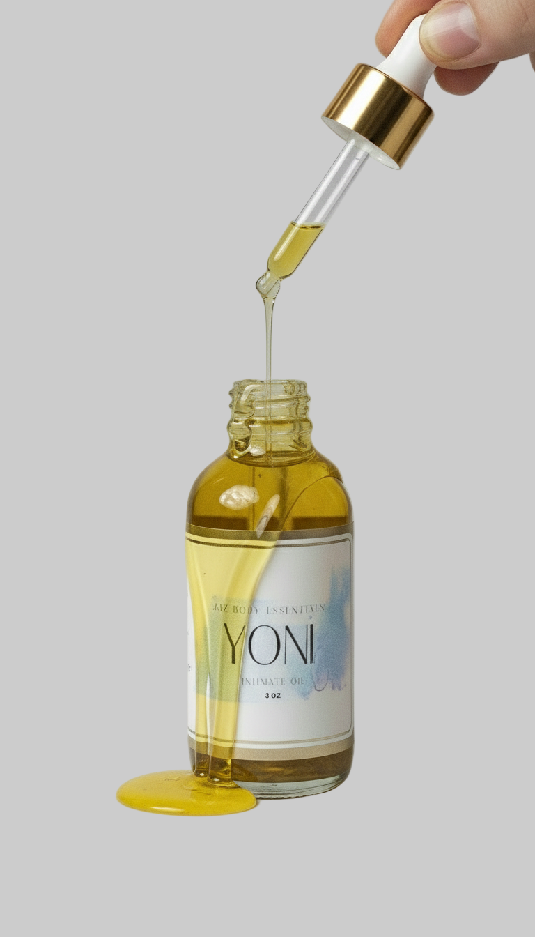 Glass bottle of Lotus Yoni Oil with an infused amethyst crystal and golden botanical blend — view 2