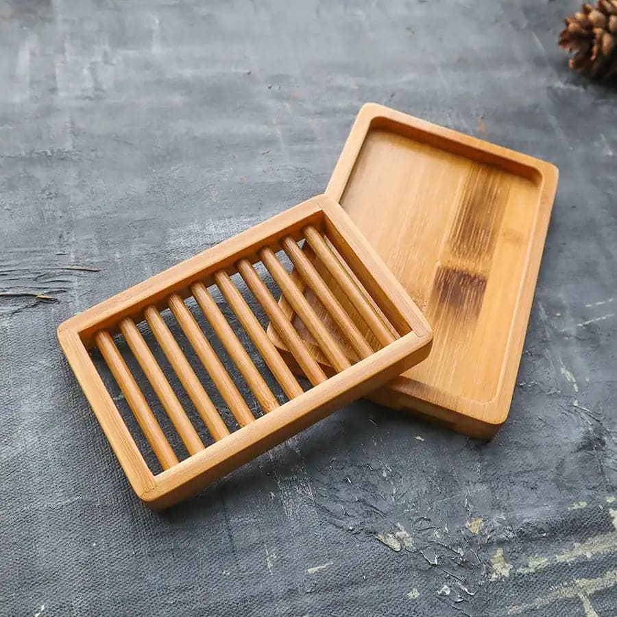 Dual-layer bamboo soap dish featuring slotted drying rack and draining tray in natural wood finish — view 4