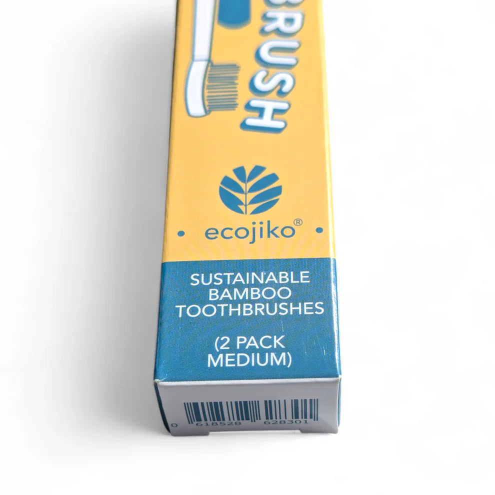 Sustainable bamboo toothbrushes with medium bristles, featuring yellow and turquoise painted tips — view 3