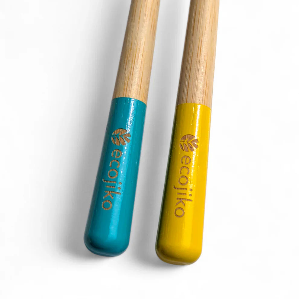 Sustainable bamboo toothbrushes with medium bristles, featuring yellow and turquoise painted tips — view 4