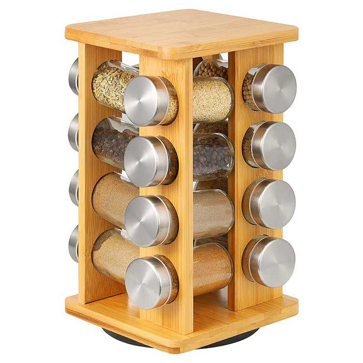 Bamboo spice rack with 16 clear glass storage jars on a rotating wooden kitchen carousel.