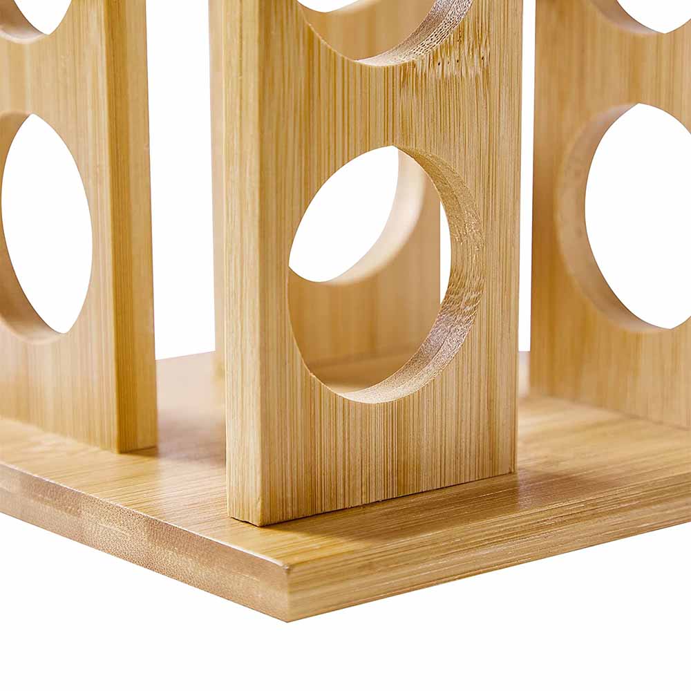 Bamboo spice rack with 16 clear glass storage jars on a rotating wooden kitchen carousel. — view 4