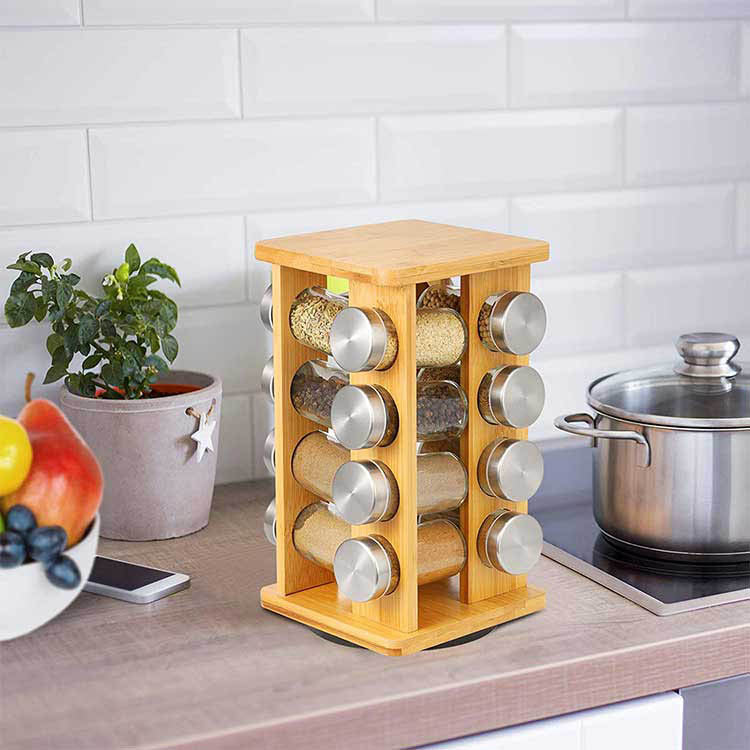 Bamboo spice rack with 16 clear glass storage jars on a rotating wooden kitchen carousel. — view 2