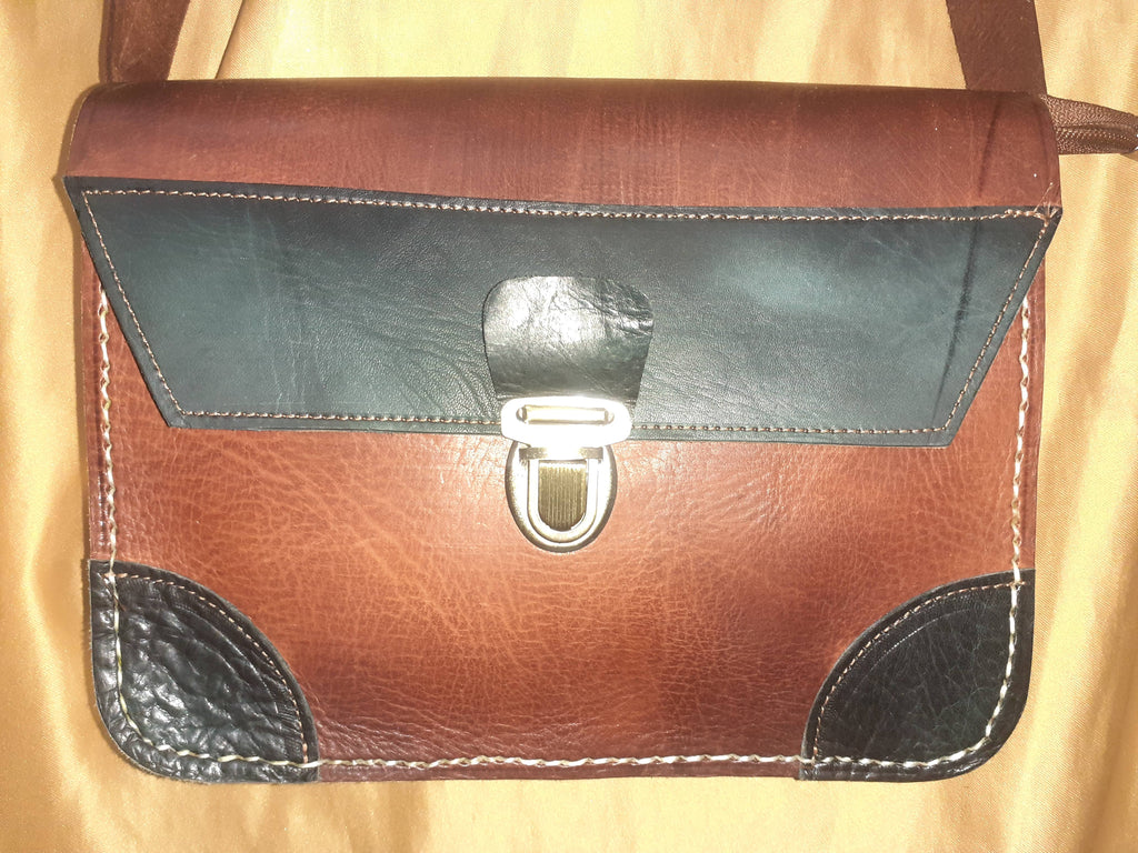 Two-tone leather crossbody bag with rustic finish, front zipper pocket, and long adjustable shoulder strap — view 12