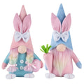 Two soft textile Easter gnome plush toys in vibrant pink and azure colors standing upright