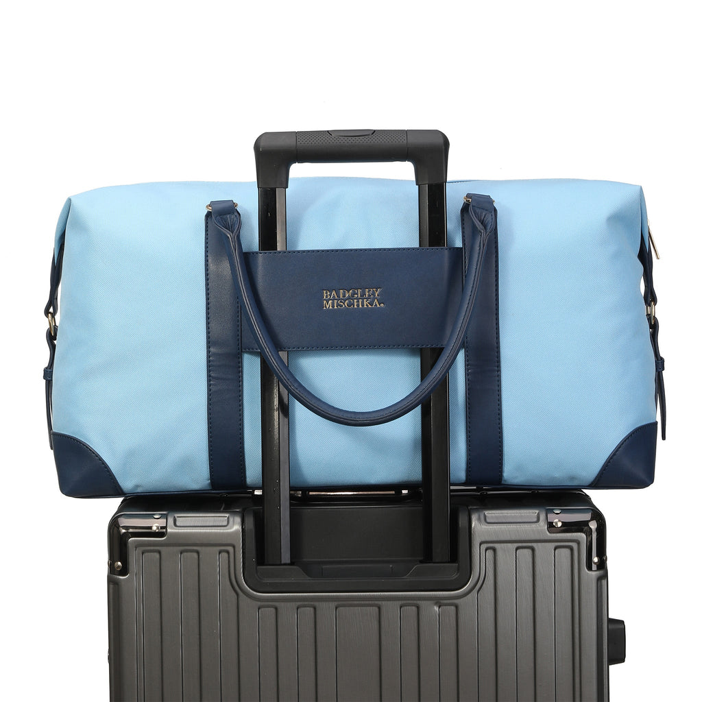 Canvas weekender duffel bag with vegan leather straps and shiny gold hardware — view 2