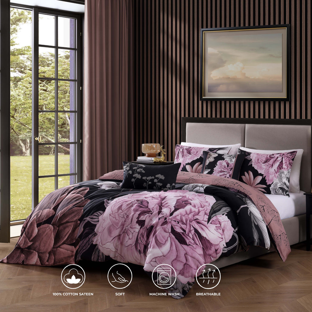 Black and pink floral reversible cotton comforter set with shams and decorative pillows on bed — view 2