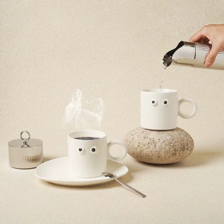 Handmade ceramic coffee mug featuring a funny big eyes cartoon design and a sturdy handle — view 3