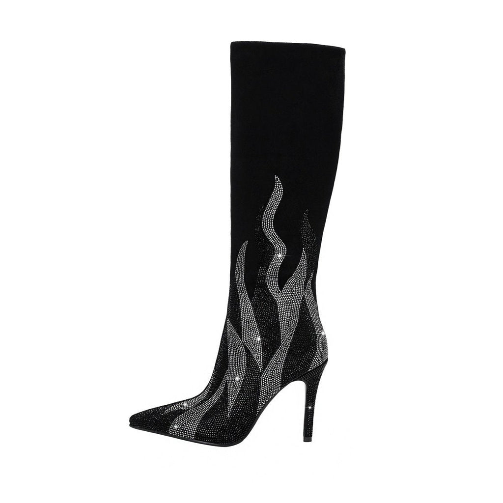 Black suede knee-high stiletto boots featuring a silver rhinestone flame design and pointed toe