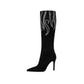 Black suede knee high boots with silver rhinestone flame details and sleek stiletto heel