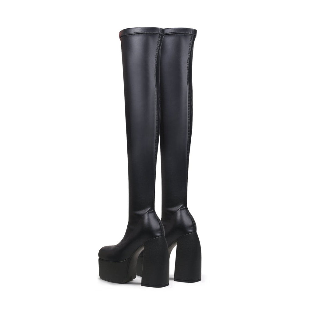 Black cyberpunk knee-high boots featuring stretchable leather, a slip-on fit, and sturdy block heels — view 4