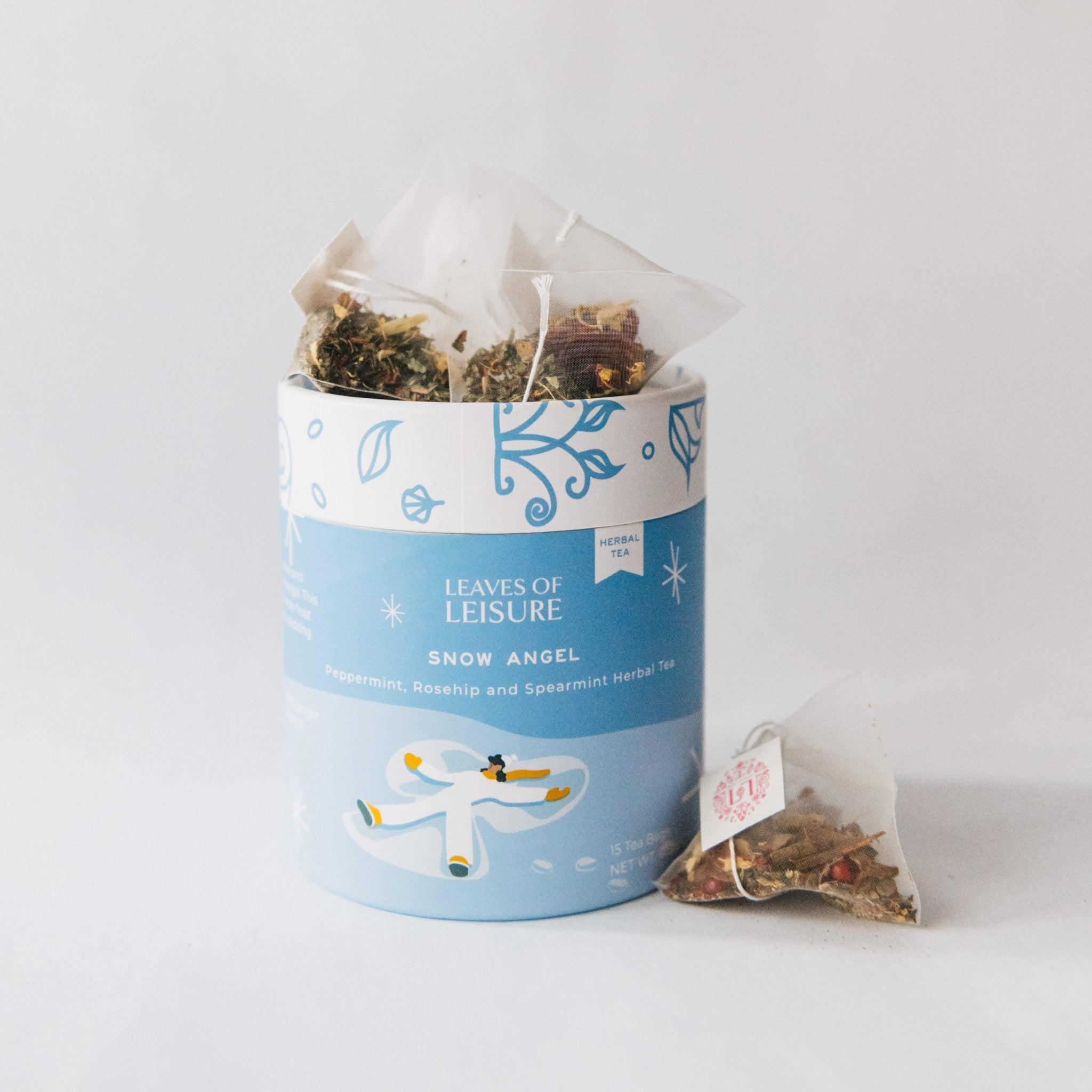 Snow Angel herbal tea blend in a reusable keepsake paper canister with compostable mesh bags — view 4