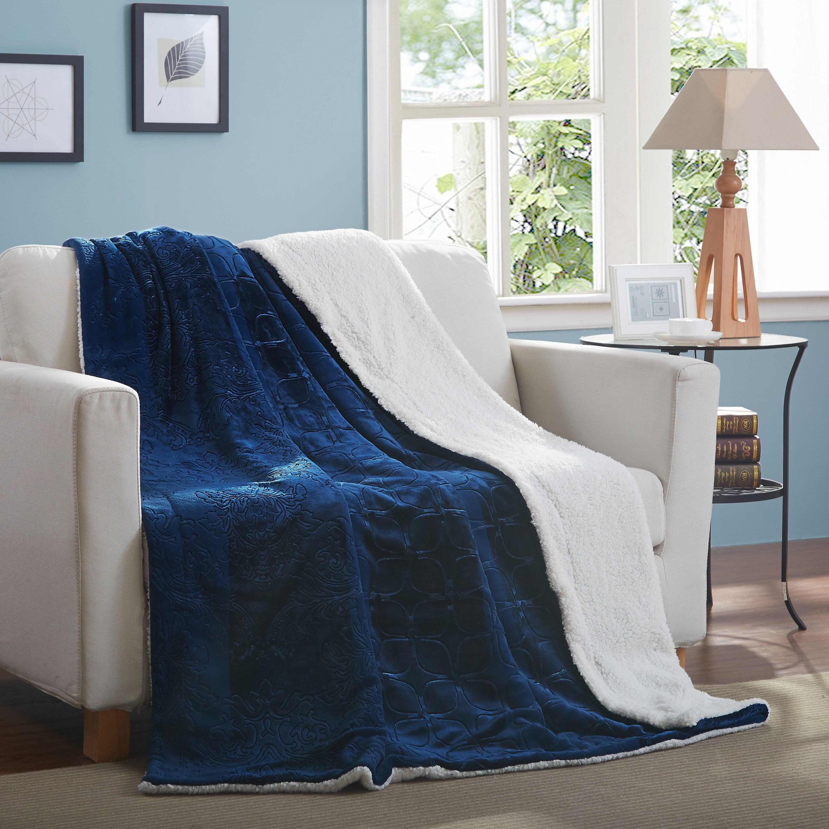 Night blue sherpa throw blanket featuring an elegant embossed floral and paisley microfleece front.