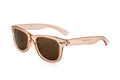 Translucent pink kids wayfarer sunglasses with brown tinted lenses and glossy acetate finish