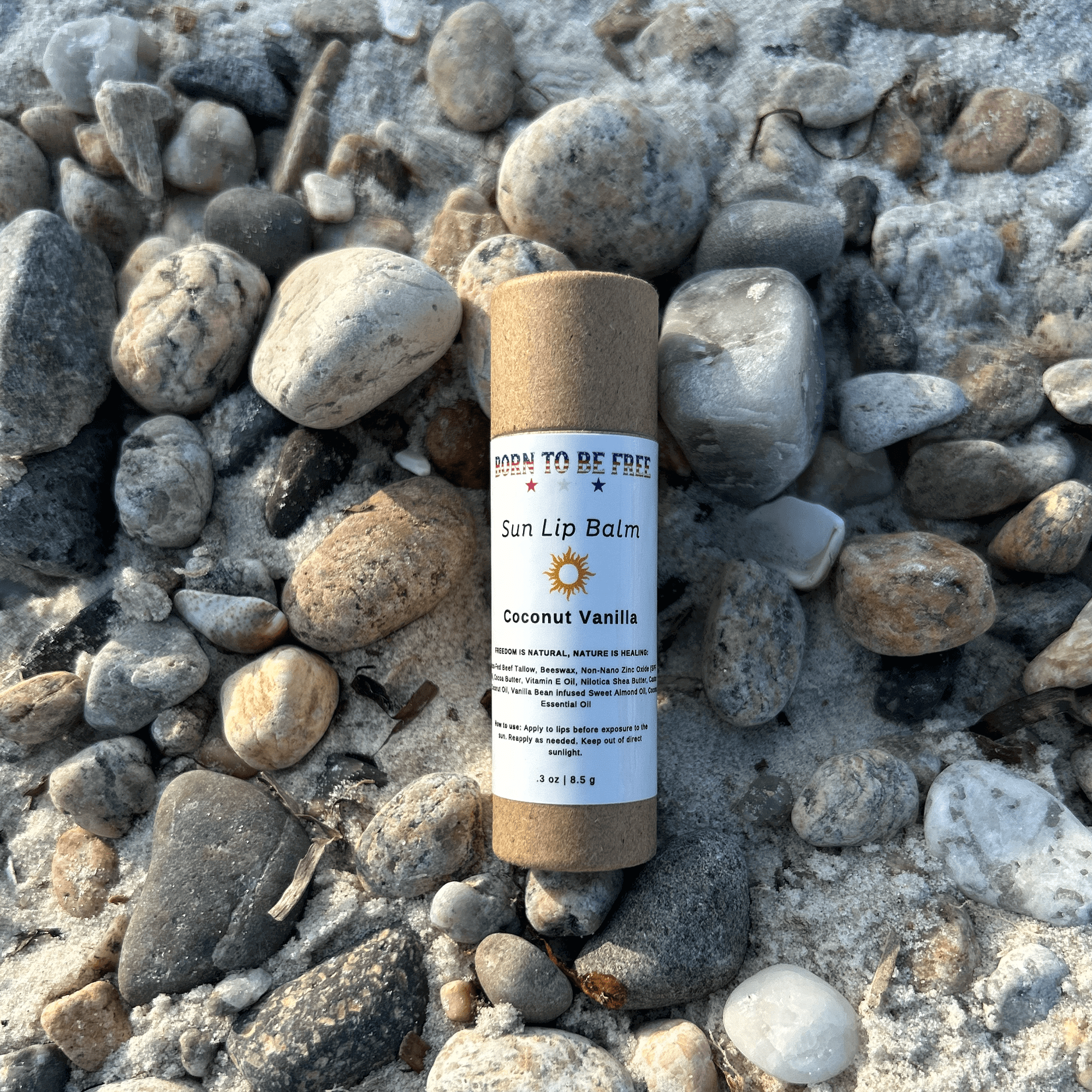 Natural sun lip balm tube in neutral tones with SPF mineral protection and tallow formulation