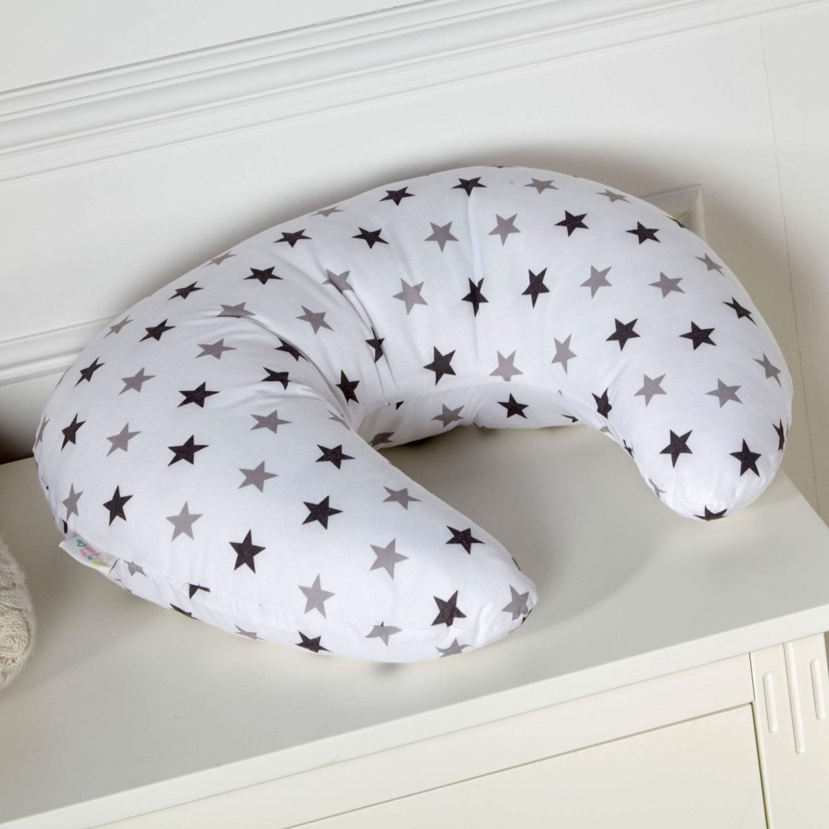 C-shaped maternity nursing pillow featuring a cotton cover with a silver twinkle star pattern — view 4