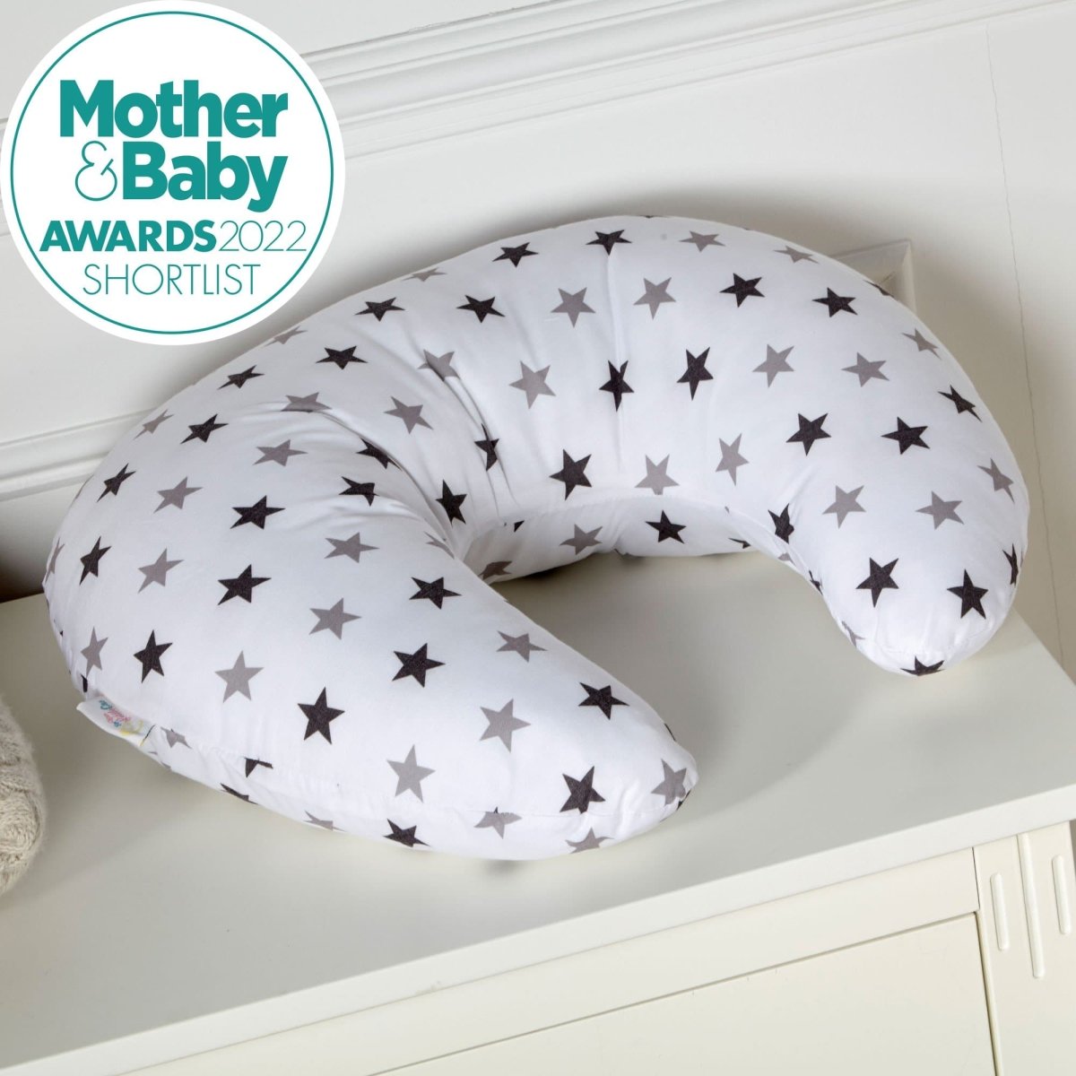 C-shaped maternity nursing pillow featuring a cotton cover with a silver twinkle star pattern — view 2