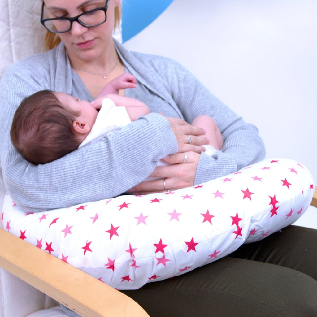 Soft pink breastfeeding nursing pillow cover featuring a delicate white star pattern and zipper — view 4