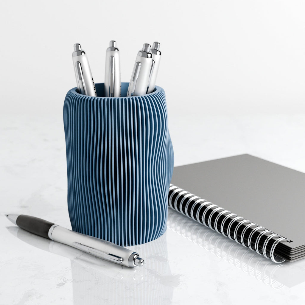 Wavy textured modern pencil holder organizing pens on a desk, made of eco-friendly materials. — view 3