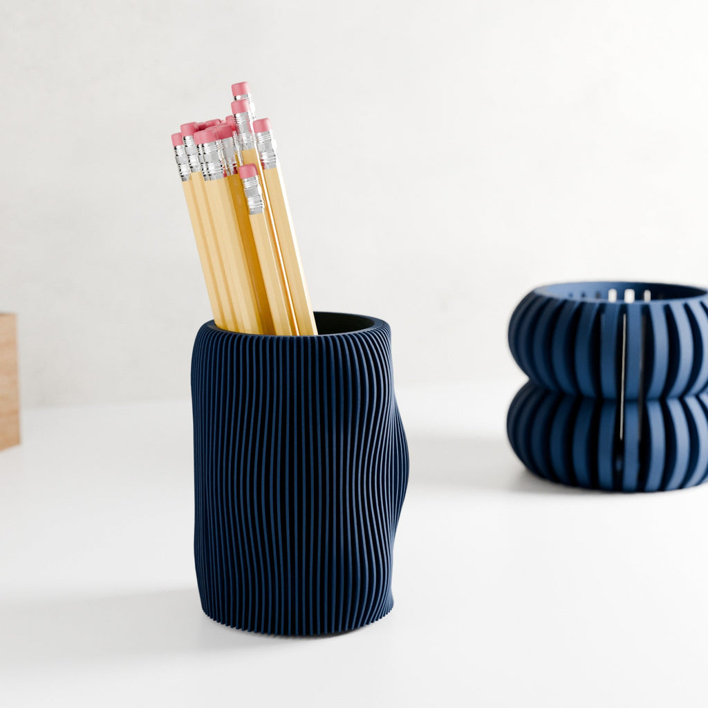 Wavy textured modern pencil holder organizing pens on a desk, made of eco-friendly materials. — view 4