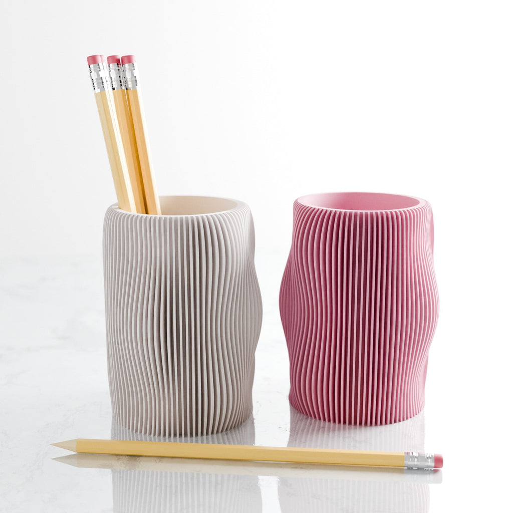 Wavy textured modern pencil holder organizing pens on a desk, made of eco-friendly materials. — view 5