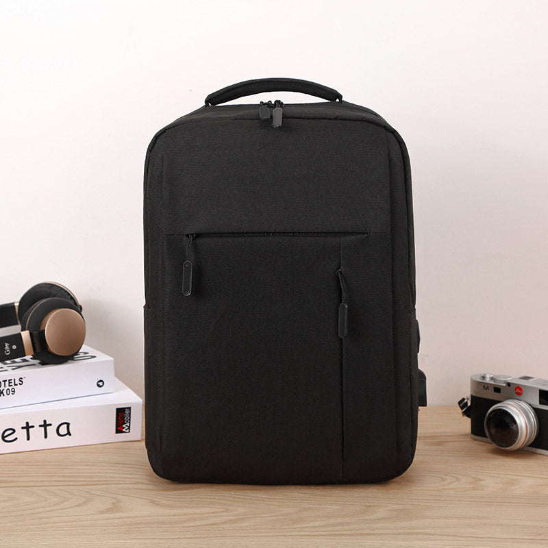 Premium grey minimalist travel backpack with padded straps and sleek modern design for daily commute — view 2