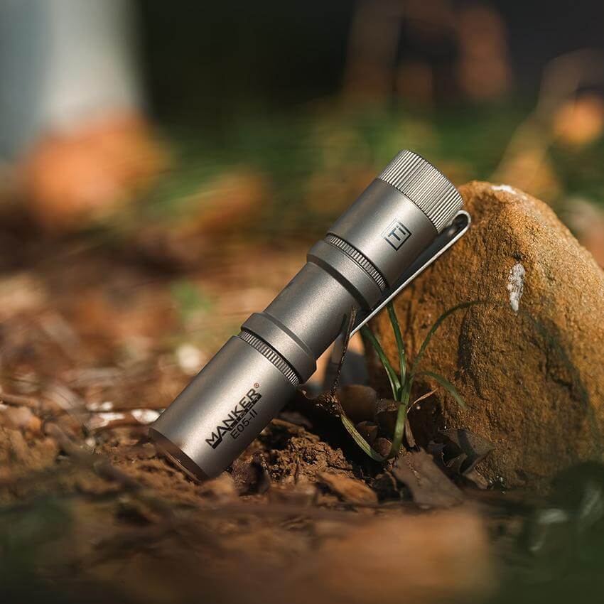 Manker E05II Ti EDC Flashlight in bead-blasted titanium with deep carry pocket clip — view 3