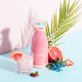 Portable electric blender cup in white with stainless steel blades and USB charging stand