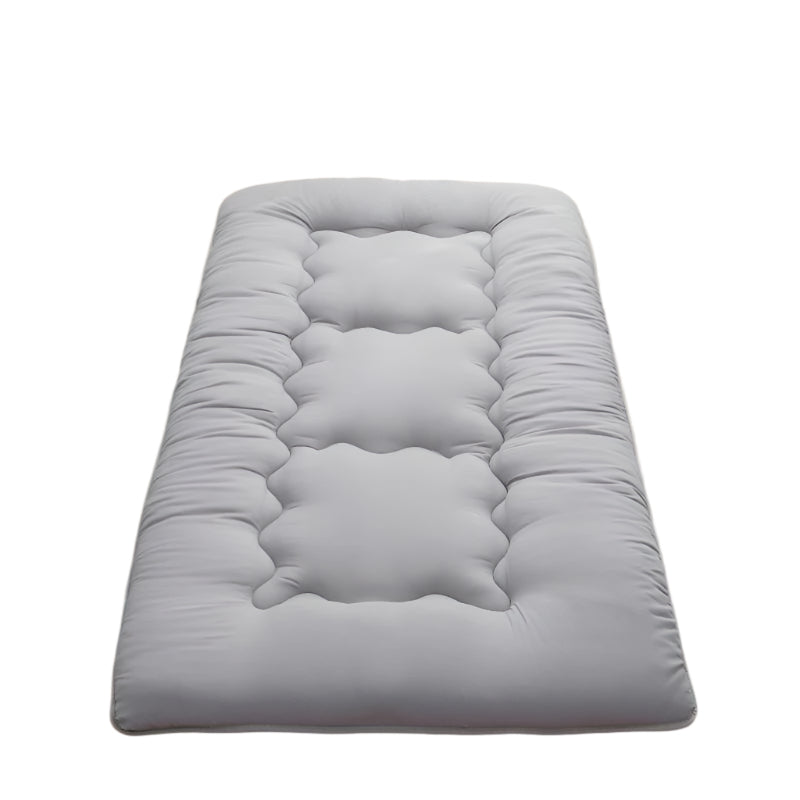 Grey foldable tatami floor futon mattress pad featuring a soft quilted surface for versatile use.