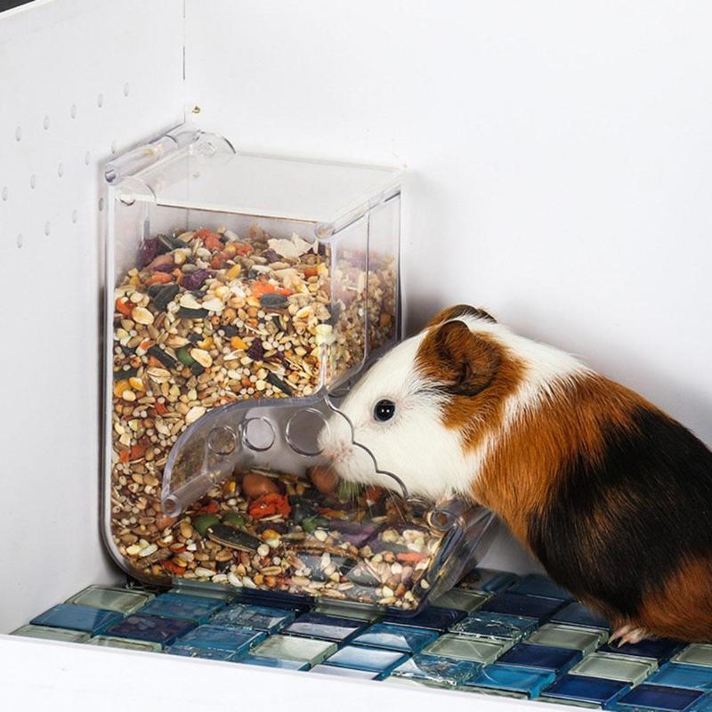 Transparent plastic hamster feeder food box attached securely to small pet cage wire — view 3